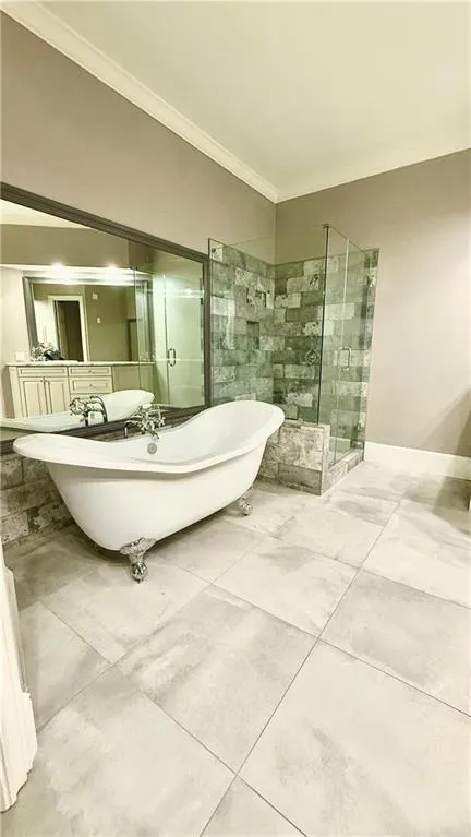 Primary bathroom with beautiful clawfoot tub.