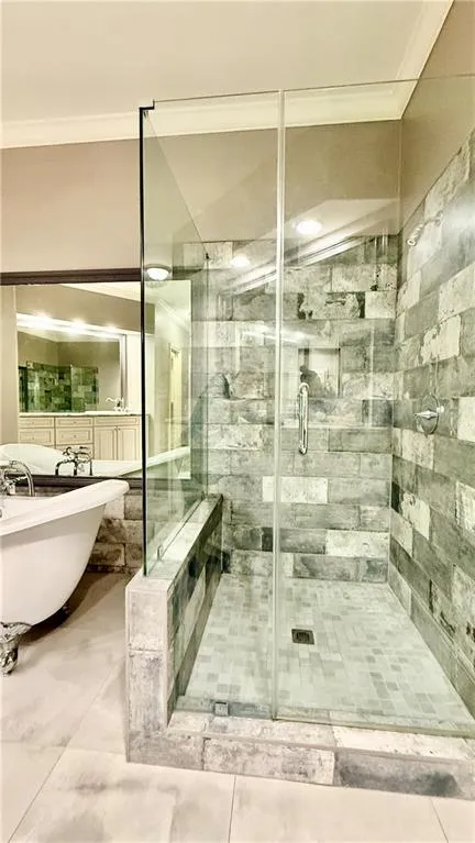 Clawfoot tub and large separate shower.