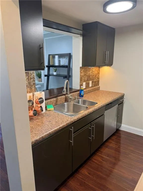 Kitchen with stainless steel appliances and backsplash