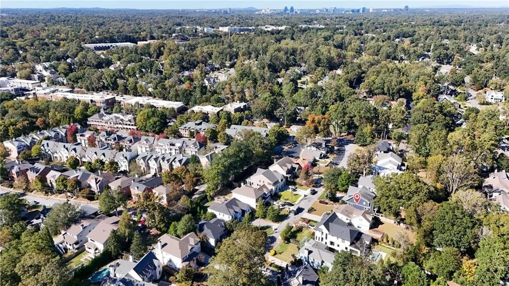 Aerial view of property's location featuring nearby suburban area