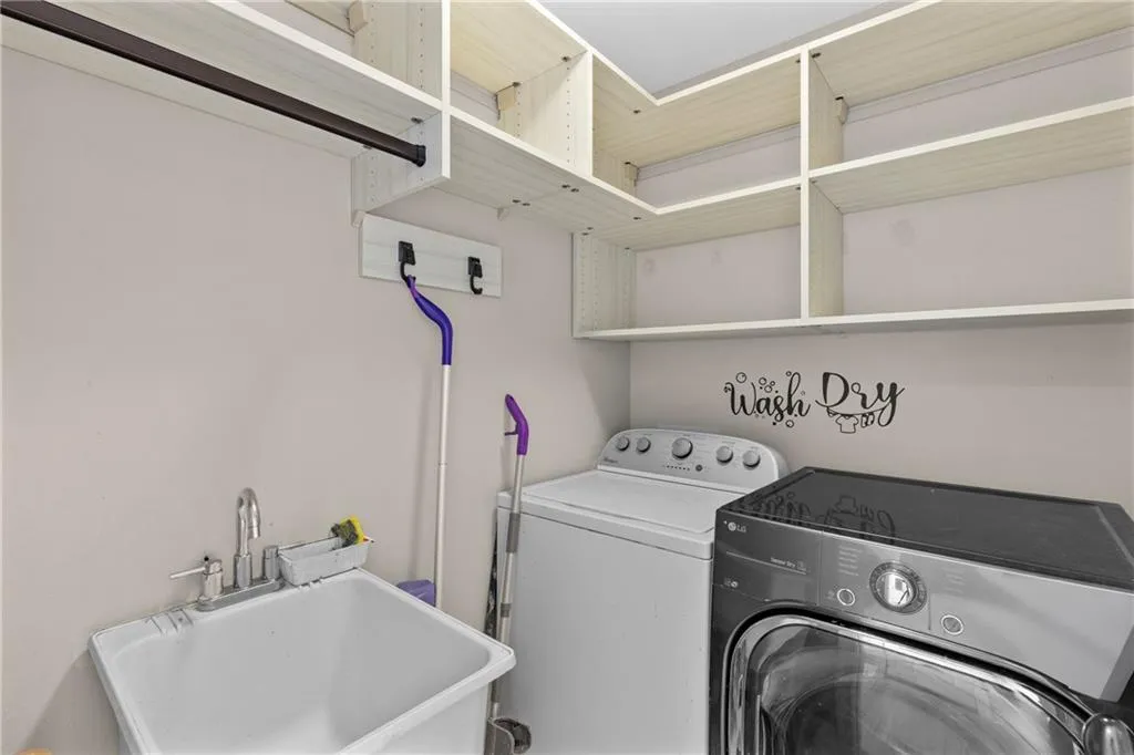 Laundry room featuring washing machine and clothes dryer