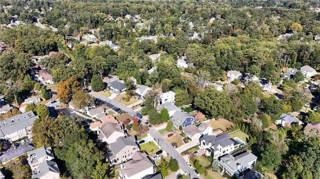 Aerial view of property's location featuring nearby suburban area