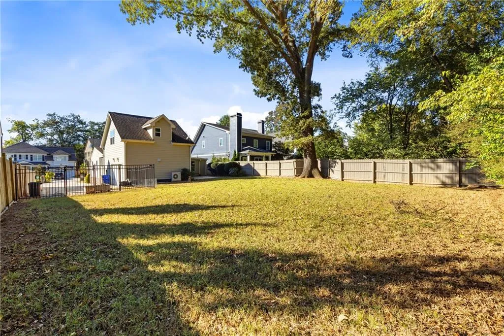Fenced backyard with a residential view