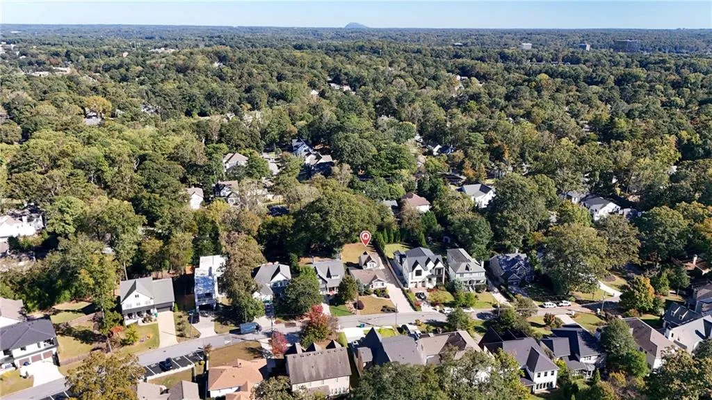 Aerial view of property's location featuring nearby suburban area