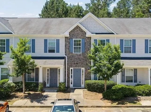 Multi-unit exterior with stone and siding facade