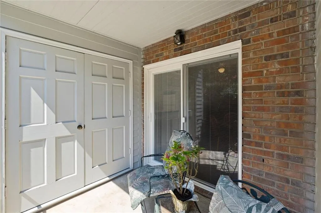 Entrance to property with brick siding