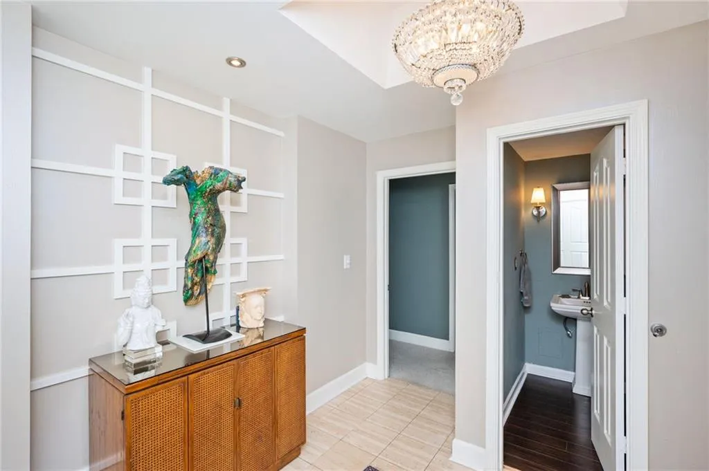 Foyer featuring Travertine floors and high ceilings