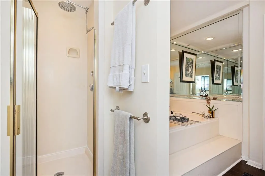 Full bath with a shower stall, 2 person soaking tub and recessed lighting