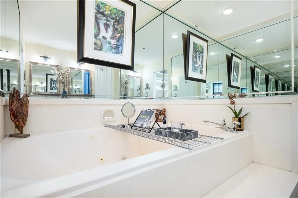 Bathroom featuring a oversized soaking tub, and recessed lighting