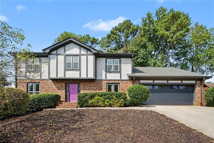 Brick and siding exterior with dark trim accents