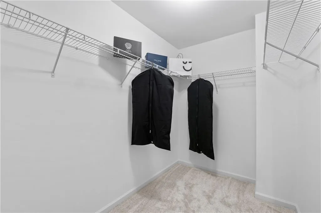 Imagine filling up this large walk-in primary bedroom closet with clothes, shoes, or even a dresser. There is plenty of space to meet your needs.