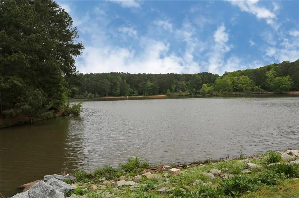Water view featuring a heavily wooded area