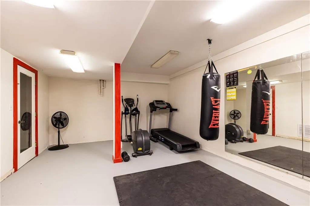 Exercise area featuring concrete floors