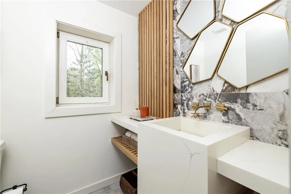 Bathroom with vanity and baseboards