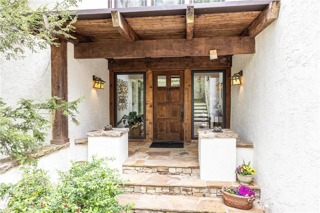 Property entrance with stucco siding