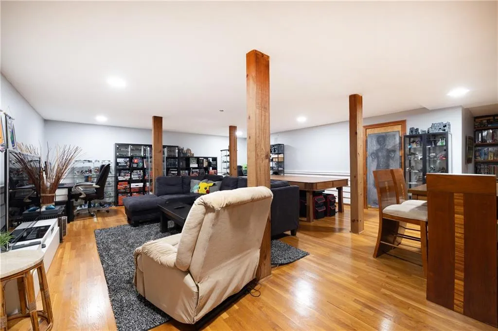 Living room featuring light wood-style floors and recessed lighting