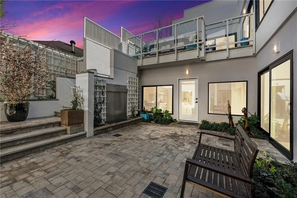 Virtual twilight shot of the main courtyard and upper breakfast patio