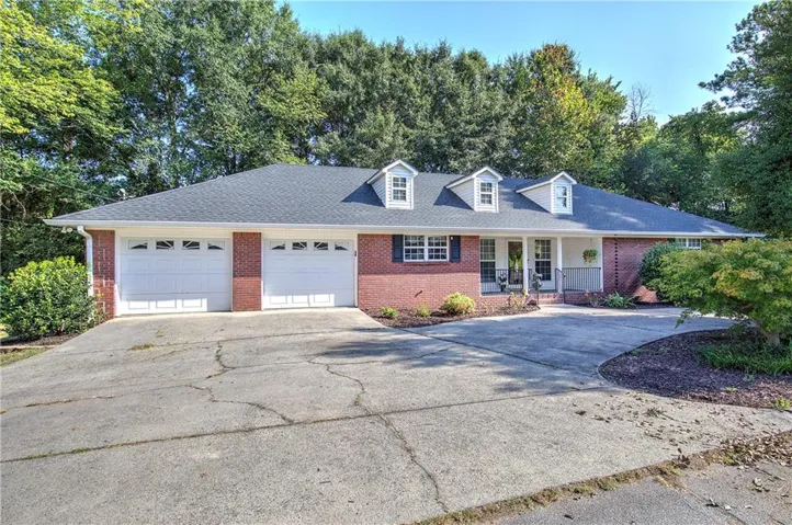 Welcome Home!  This all brick home with a circular drive is in the city of Cartersville.  In a well established older neighborhood.  You do not want to miss all the custom touches and attention to detail in this beautiful home!