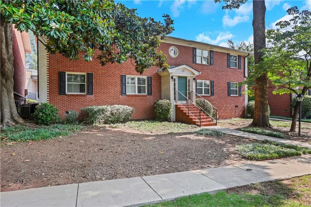 View of front of property with brick siding