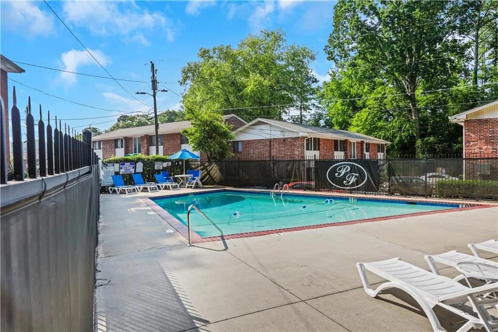 Community pool featuring a patio