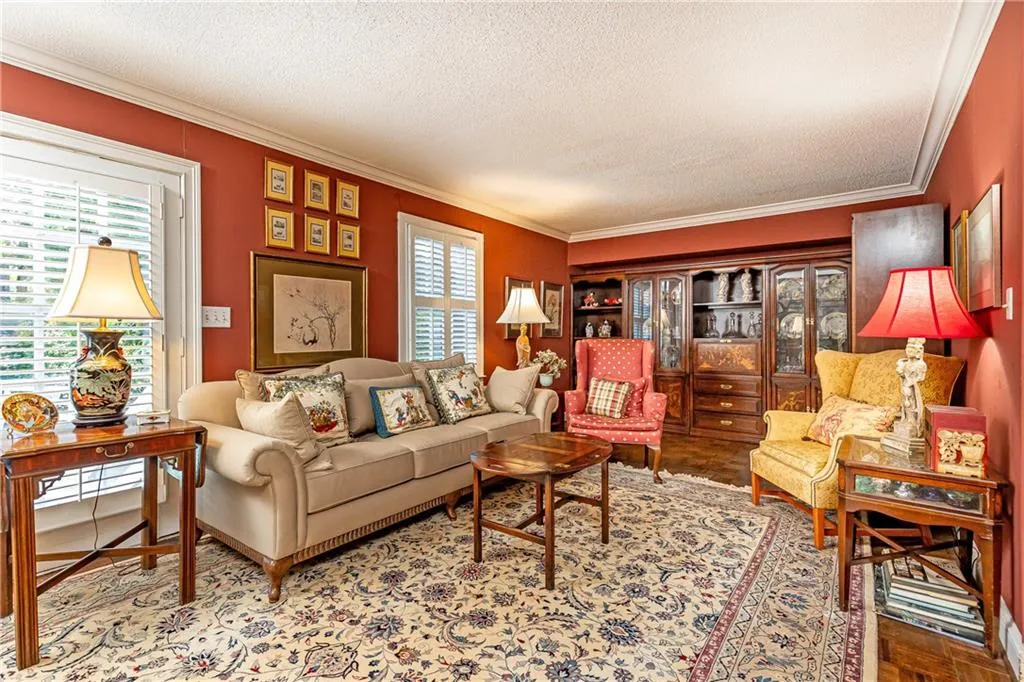 This additional living area opens up to the back yard and beautiful pool.