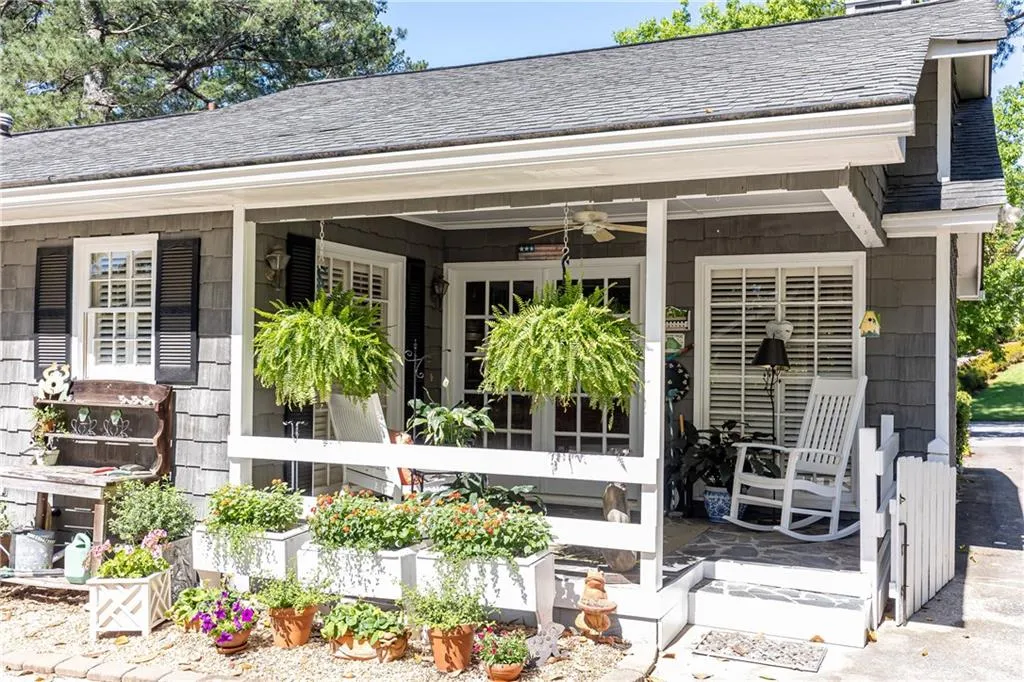 Intimate covered back porch for a moment al fresco.