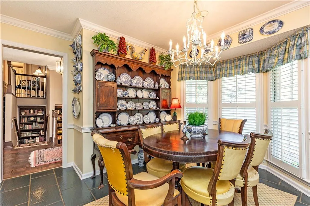 Cozy breakfast room with bay window complements the open kitchen plan.