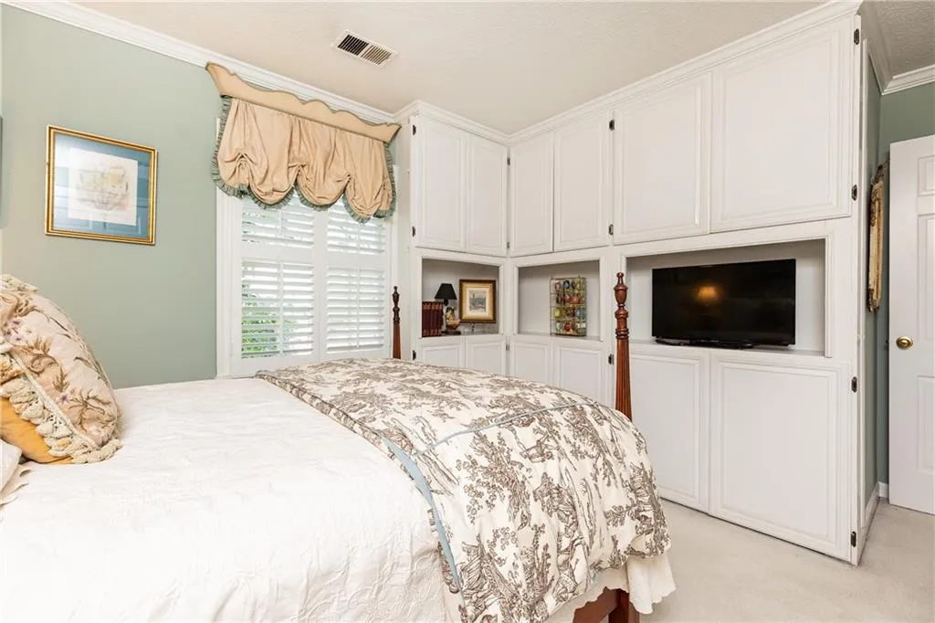 Both upstairs bedrooms have thoughtful built-in cabinetry and shelving.