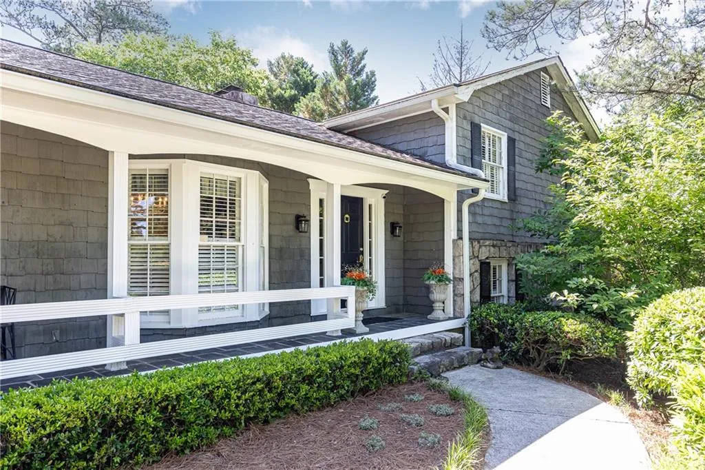 Carefully constructed in granite and shingle siding, this home has a warm and inviting look and feel.