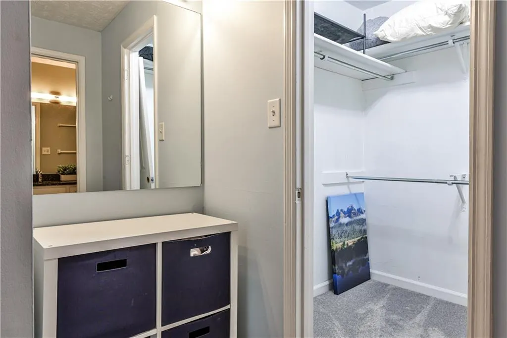 Bathroom with carpet and baseboards