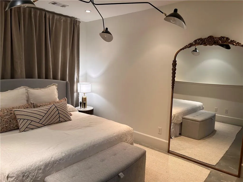 Bedroom featuring baseboards, recessed lighting, and carpet flooring