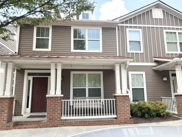 Two-story exterior with horizontal siding and board-and-batten accents