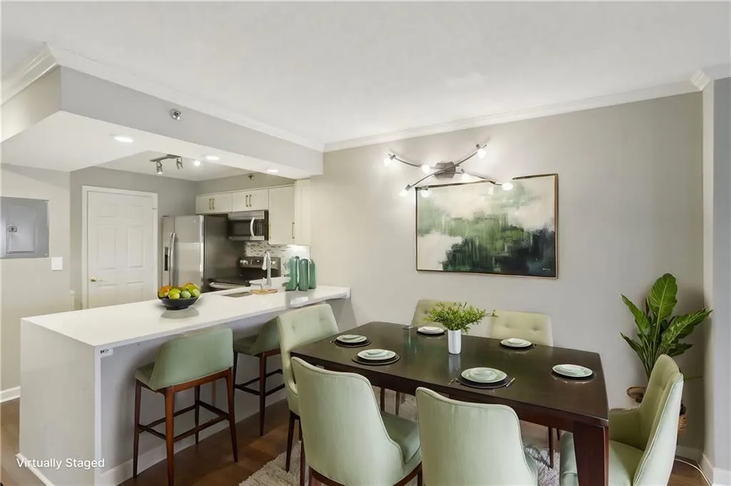 Dining area with crown molding, dark wood-type flooring, and electric panel