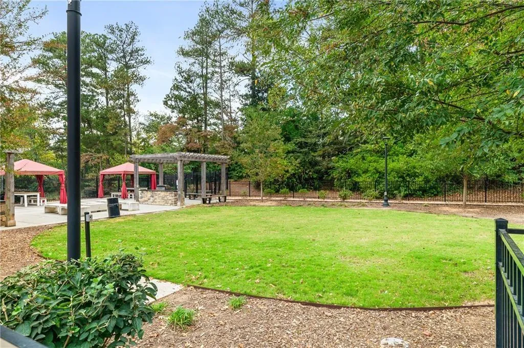 Greenspace near outdoor community area and grills
