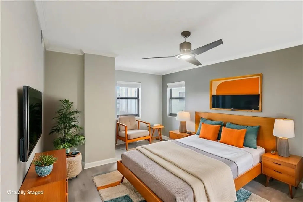 Bedroom featuring crown molding, ceiling fan, and wood-type flooring
