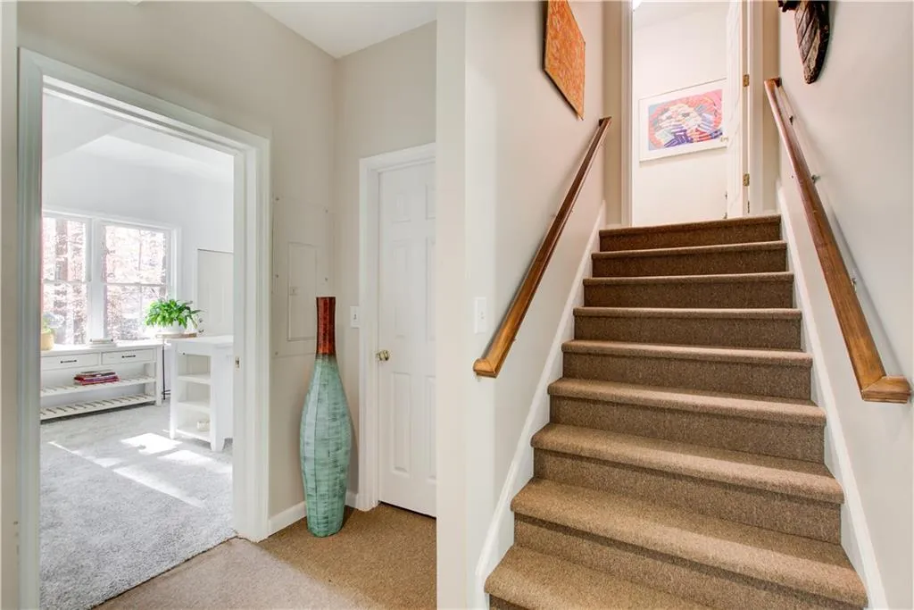 Stairs featuring carpet flooring