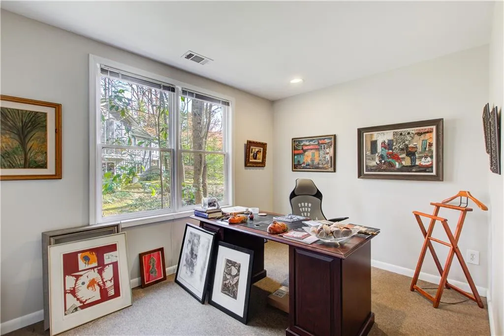 Office featuring light colored carpet and recessed lighting