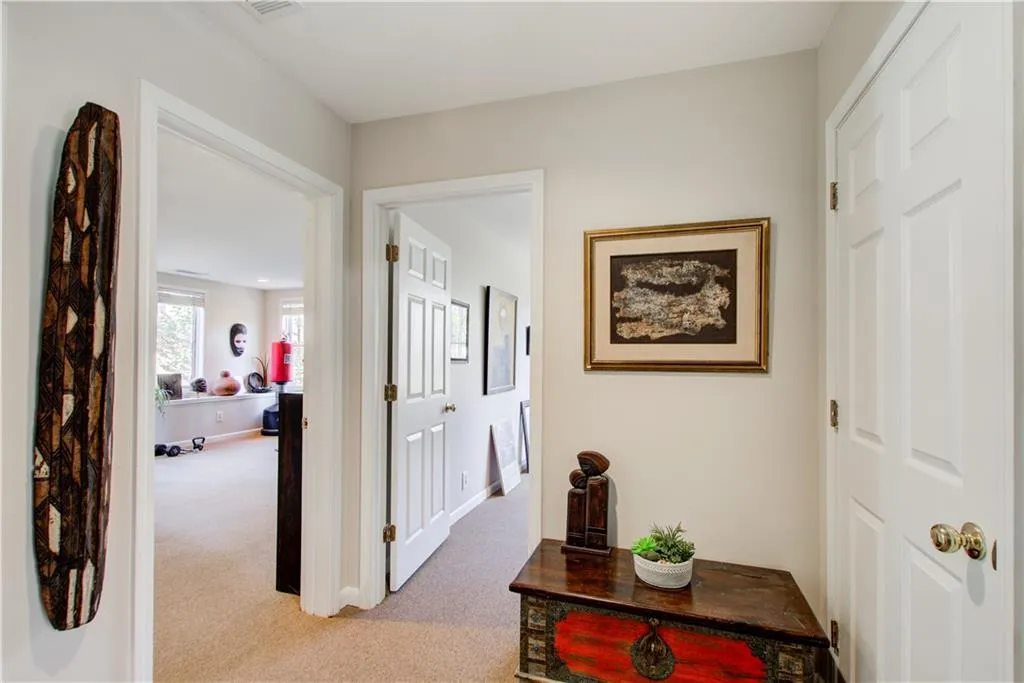 Hall featuring light carpet