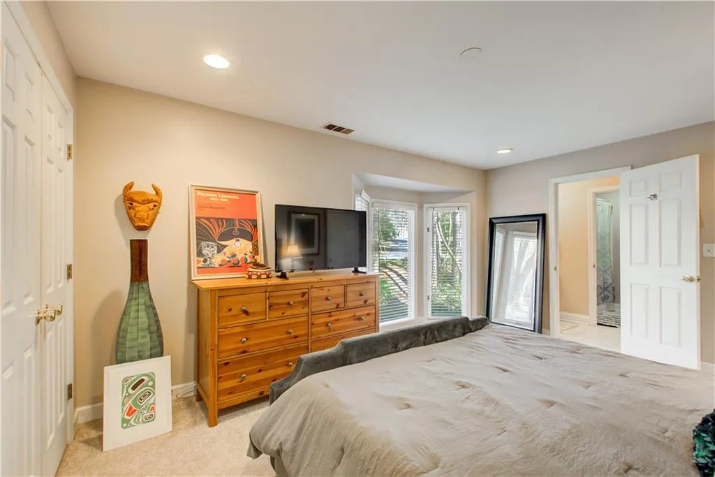 Bedroom featuring carpet, recessed lighting, and a closet