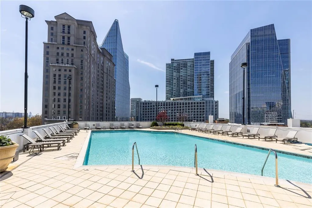 Community pool featuring a city view and a patio