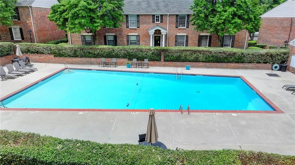 Community pool featuring a patio area