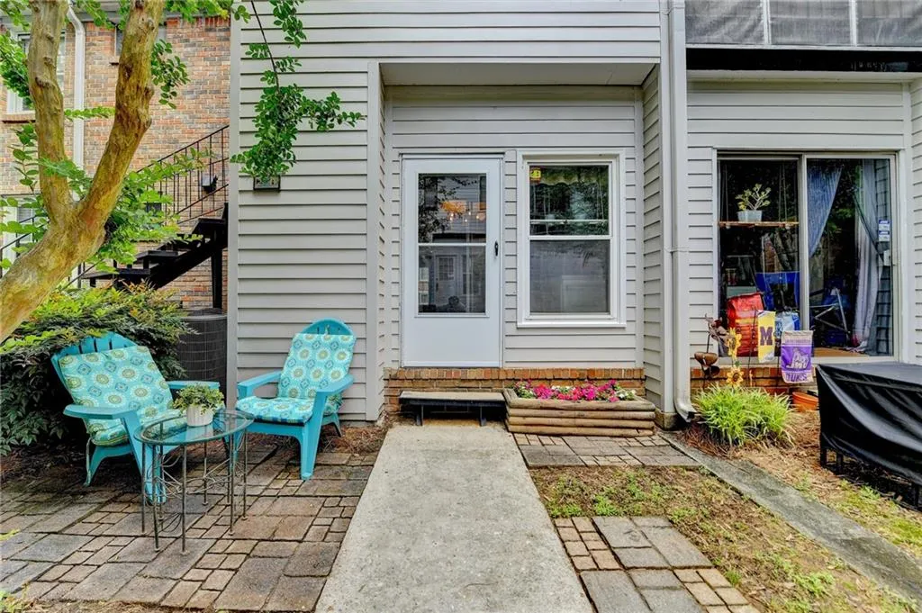 Property entrance with a patio