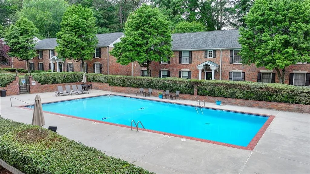Community pool with a patio