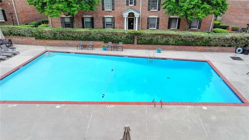 Community pool featuring a patio