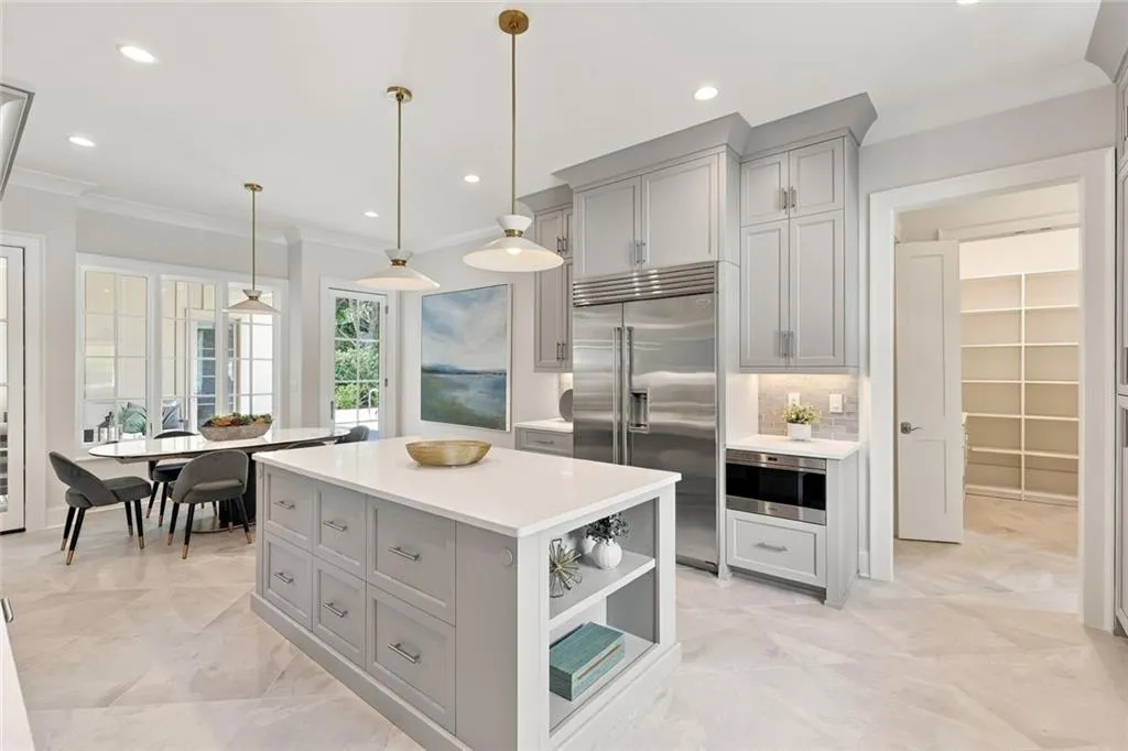 Kitchen, Pantry, Hall to Garage, Breakfast, Patio and Pool in the distance