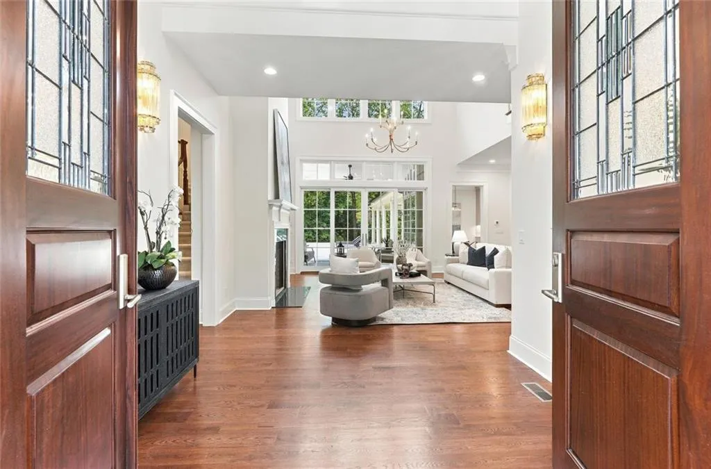Two story foyer opening to the Great Room, Patio and Pool Deck in the back
