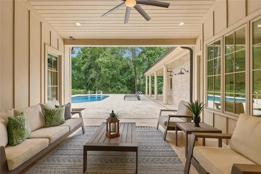 View of the Patio from the Great Room, Breakfast & Kitchen on the right, Master on the left & Pool