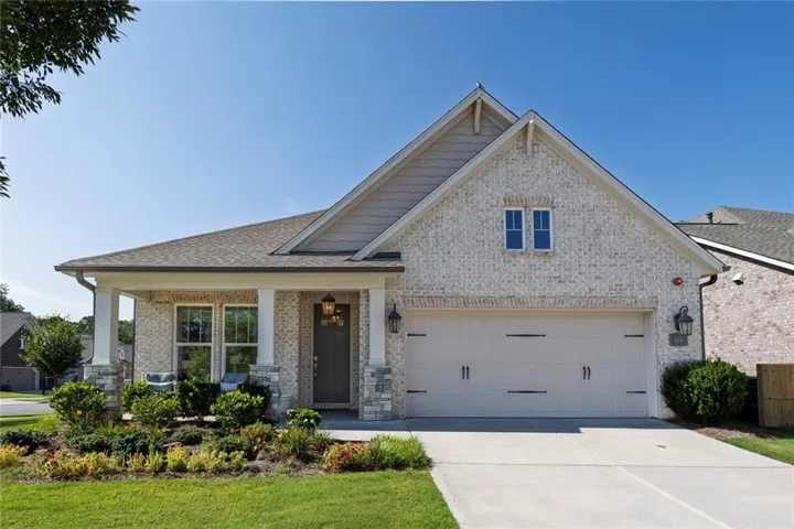 Beautifully landscaped corner lot showcasing exceptional curb appeal and a desirable neighborhood setting.