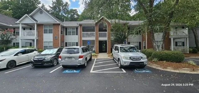 Brick and siding exterior with multiple balconies and screened porches