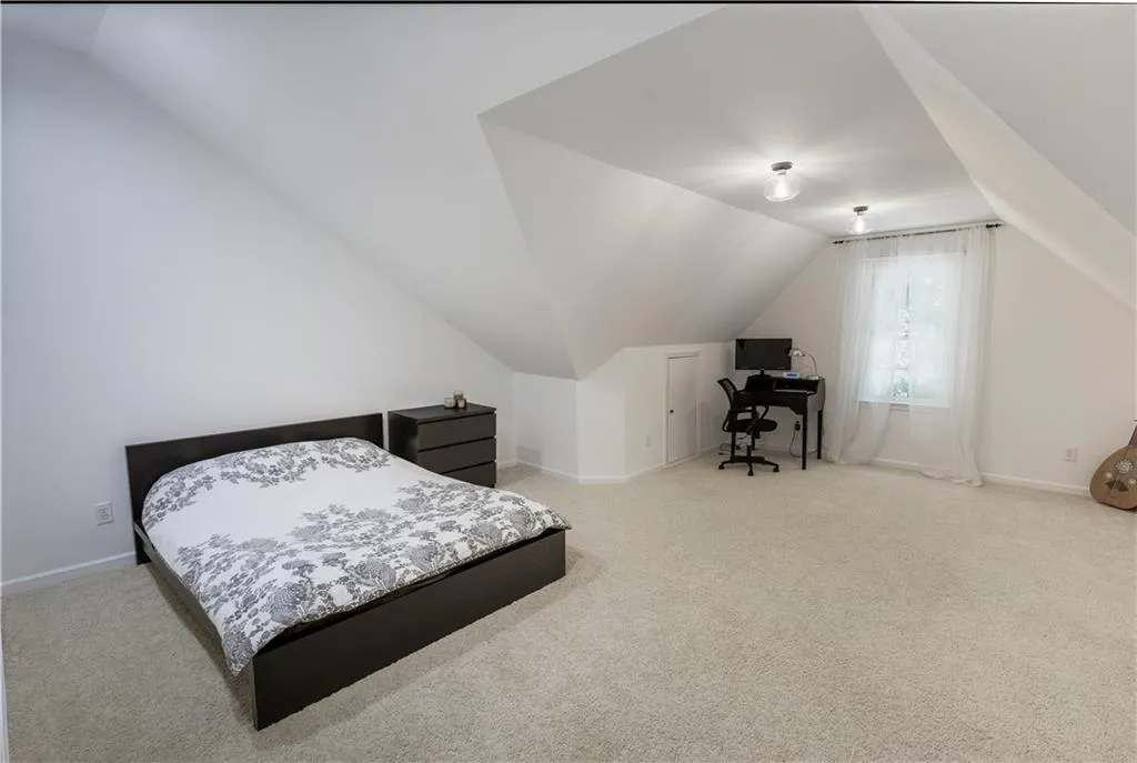 Bedroom 2.  Oversized with sitting area and walk-in closet.